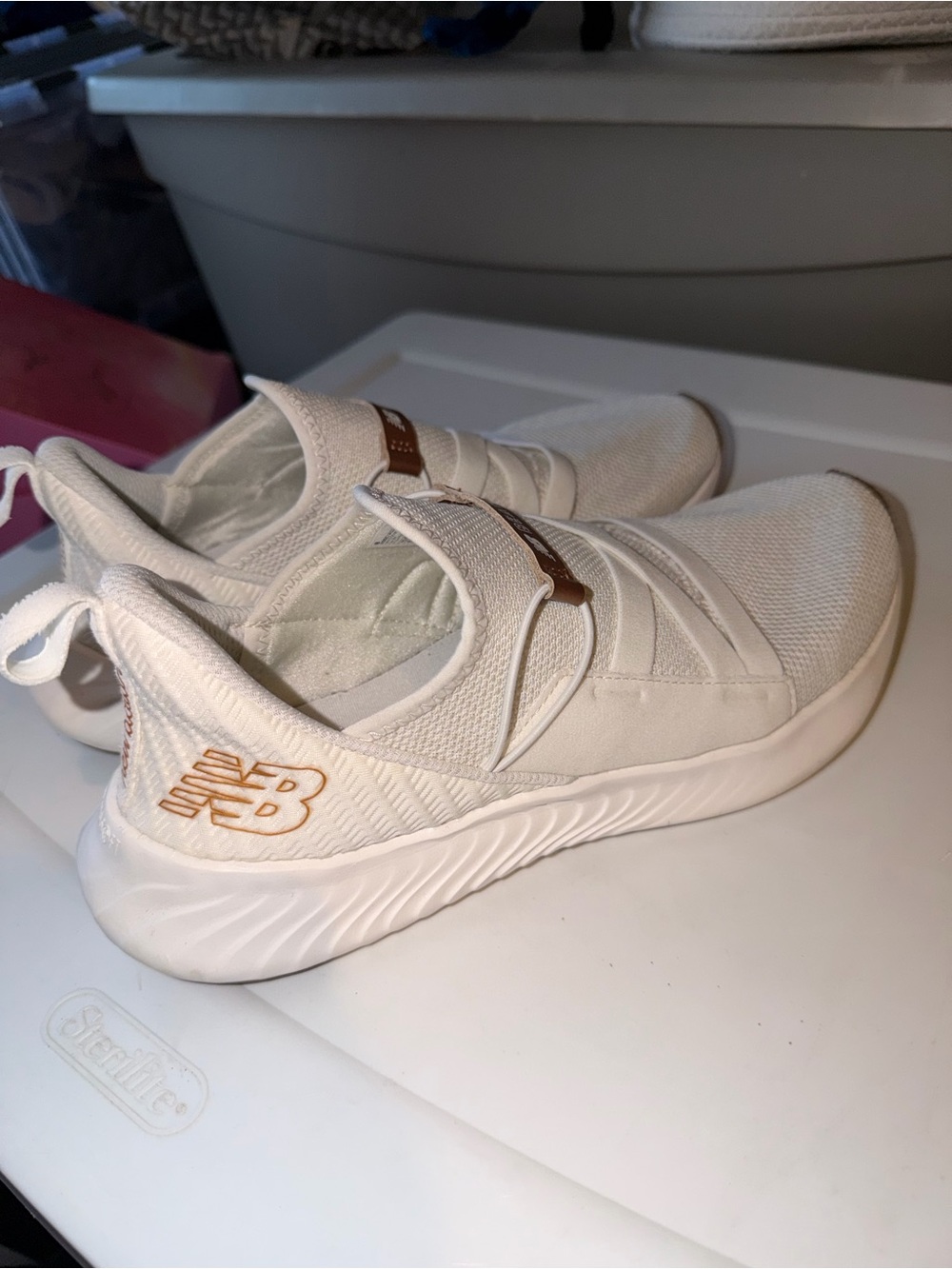 New Balance Off-White Slip-On Sneakers with Metallic Rose Accents
